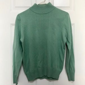 green turtleneck sweater